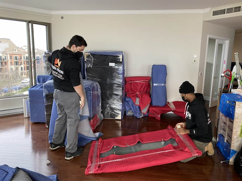 crown movers wrapping items for a secure move